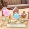 Close-up of the solid wood launcher from the Pinocchio Village Balloon Battle game